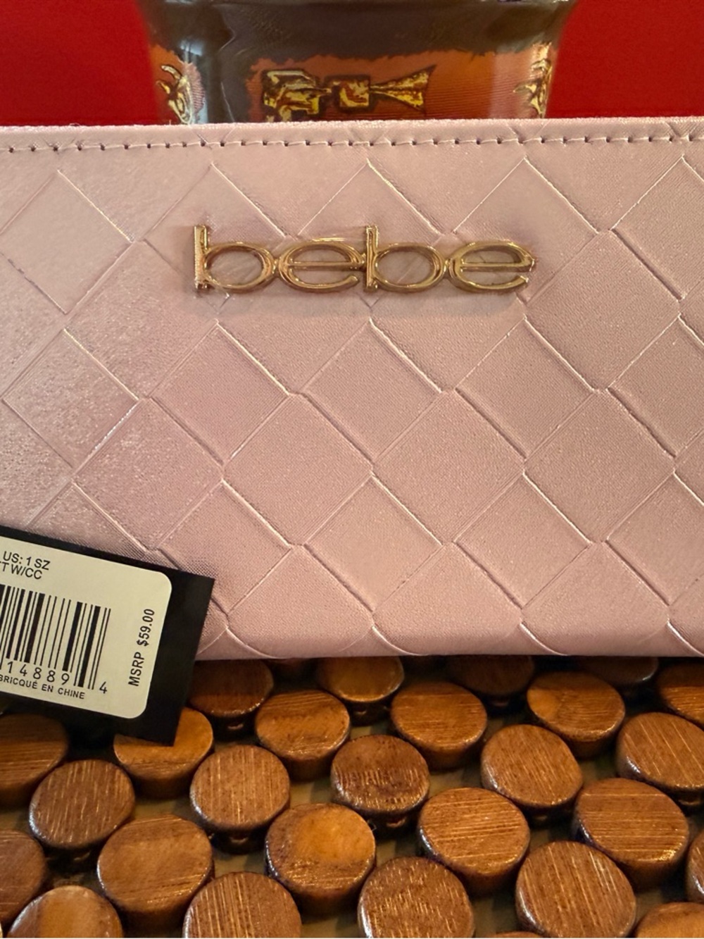 bebe Quilted Pale Pink Clutch with Gold Logo Plate
